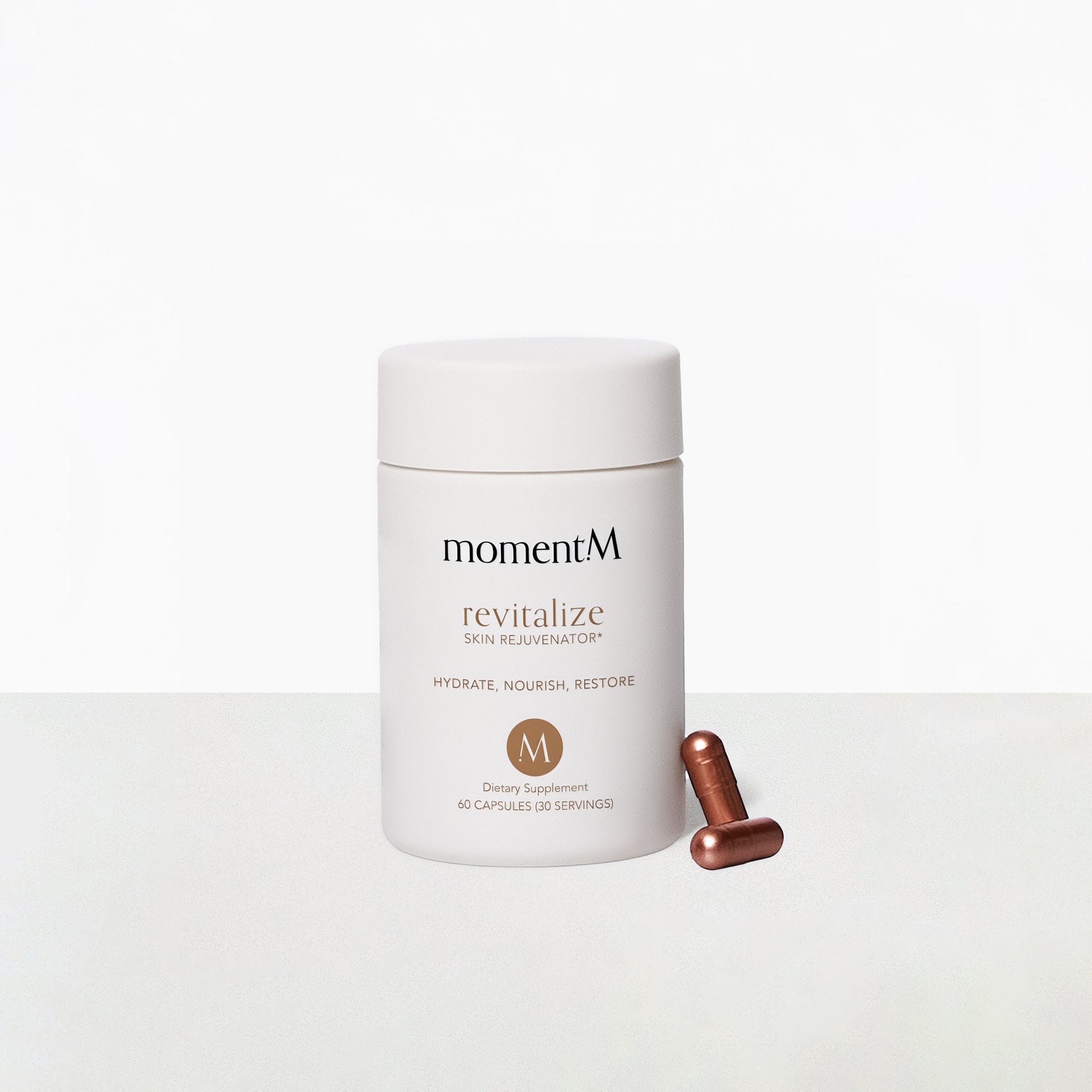 momentM revitalizing supplement container with a capsule on a white background